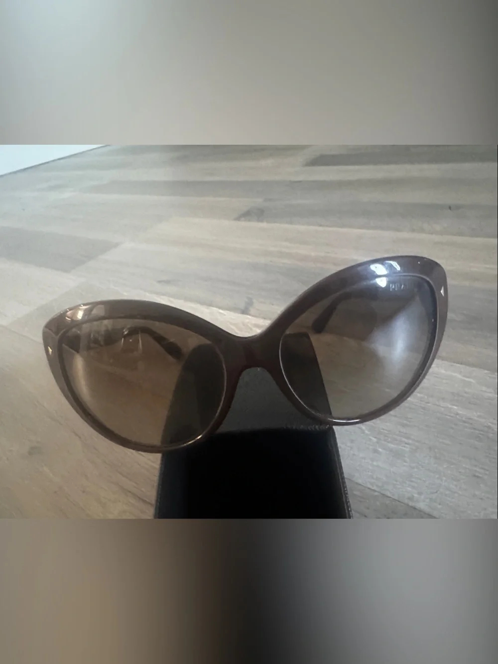 Prada Brown Women's Oval Sunglasses with Dark Brown Lenses